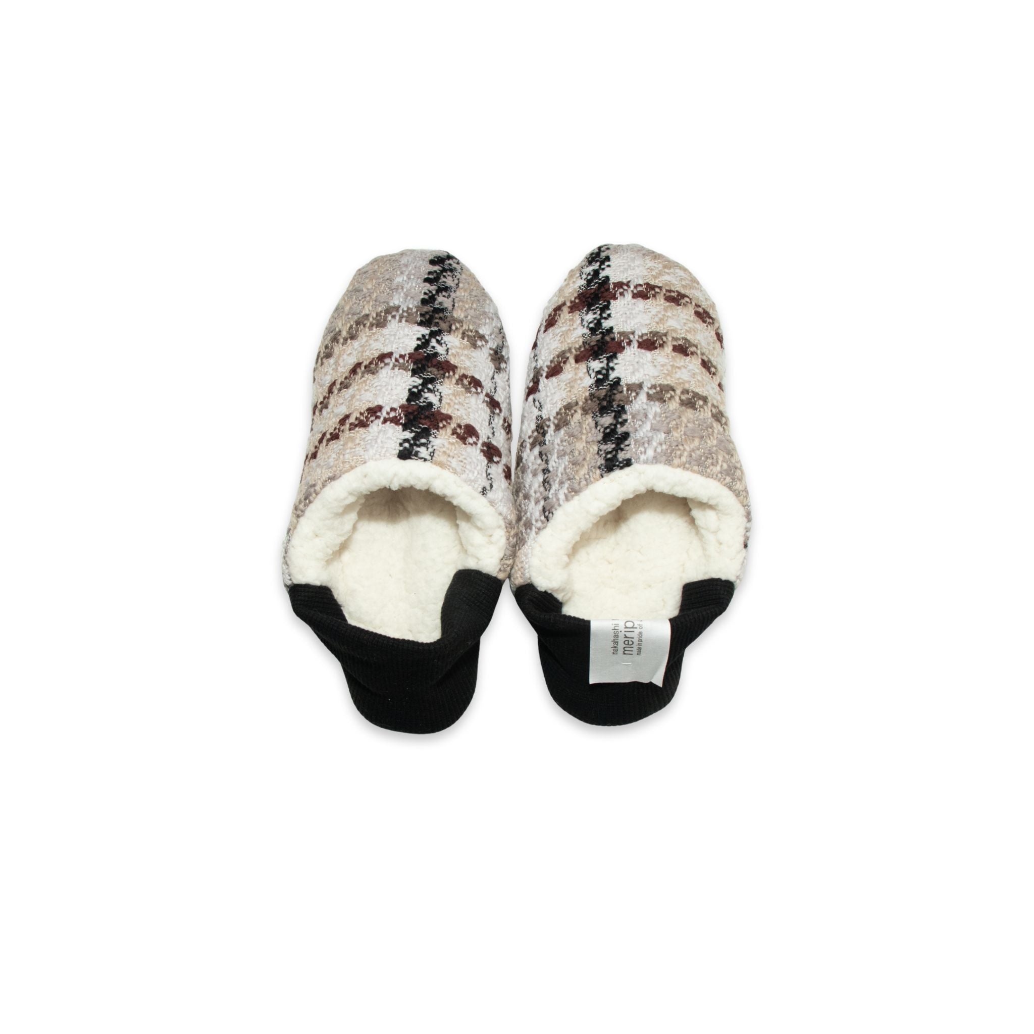 Pair of slippers with plaid pattern on a white background