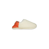 Side view of creme  slipper with orange on a white background