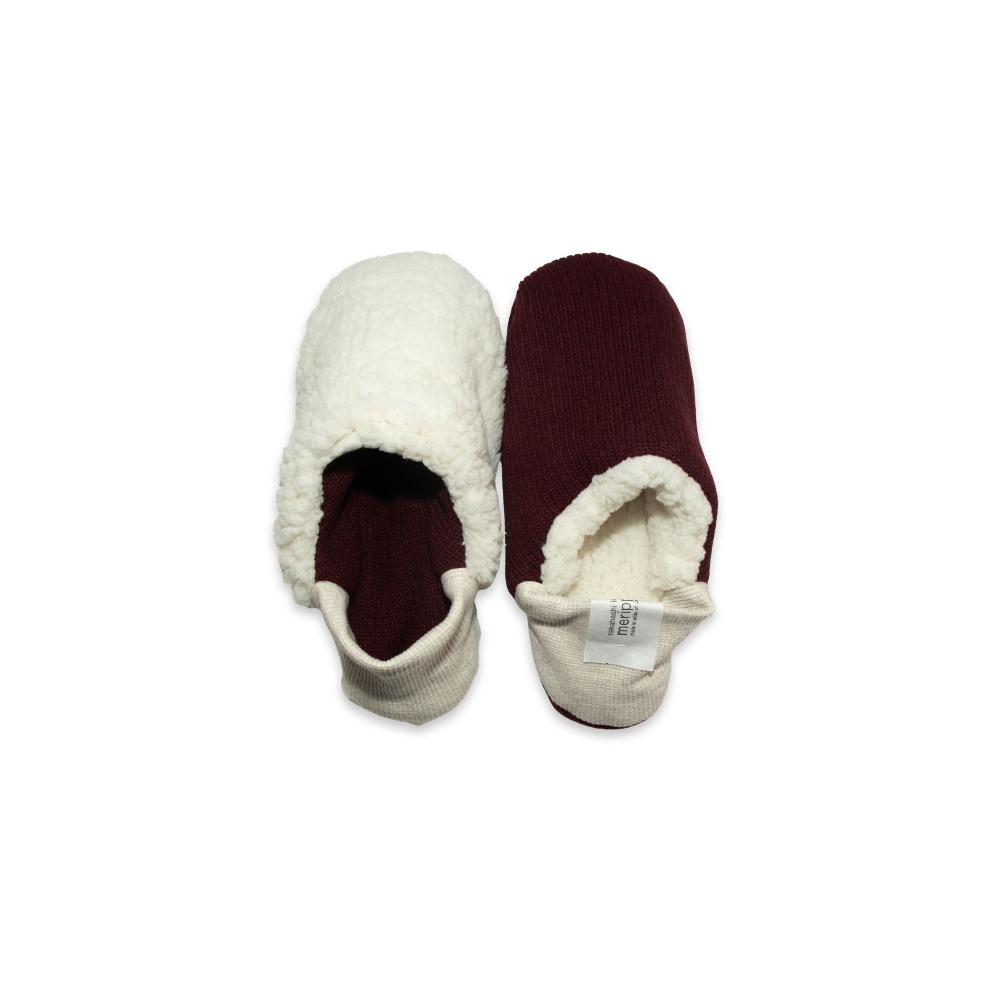 A pair of burgundy colored  slippers with white trim on a white background