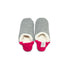 A pair of dark grey colored  slippers with pink trim on a white background