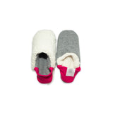 A pair of dark grey colored  slippers with pink trim on a white background