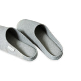 Pair of gray slippers on a white background