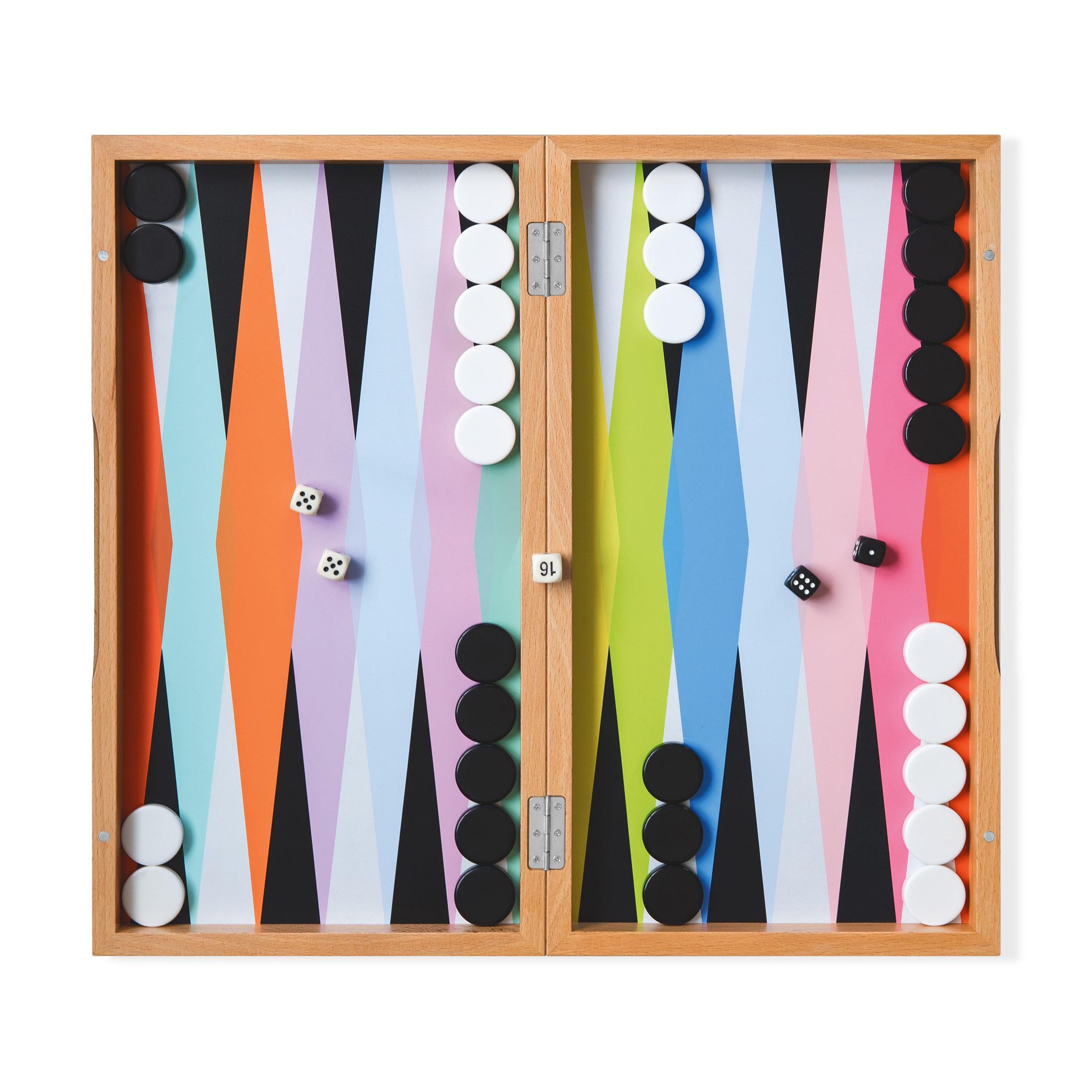 Top view of the colorful MoMA Backgammon set opened and all pieces in place ready to be played including the dice on a white background