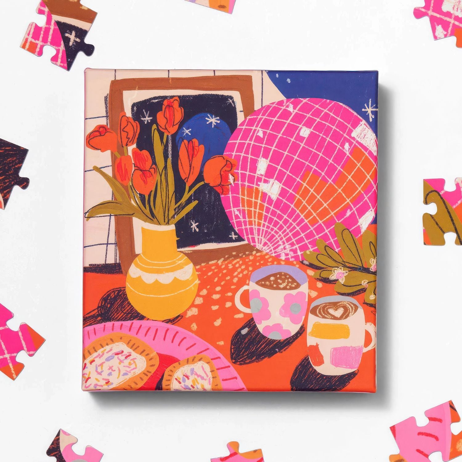 Top view of Ordinary Habit's 100pc Disco Tea puzzle box with puzzle pieces on a white background