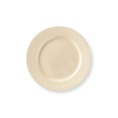 Beige ceramic plate with textured rim on a white background
