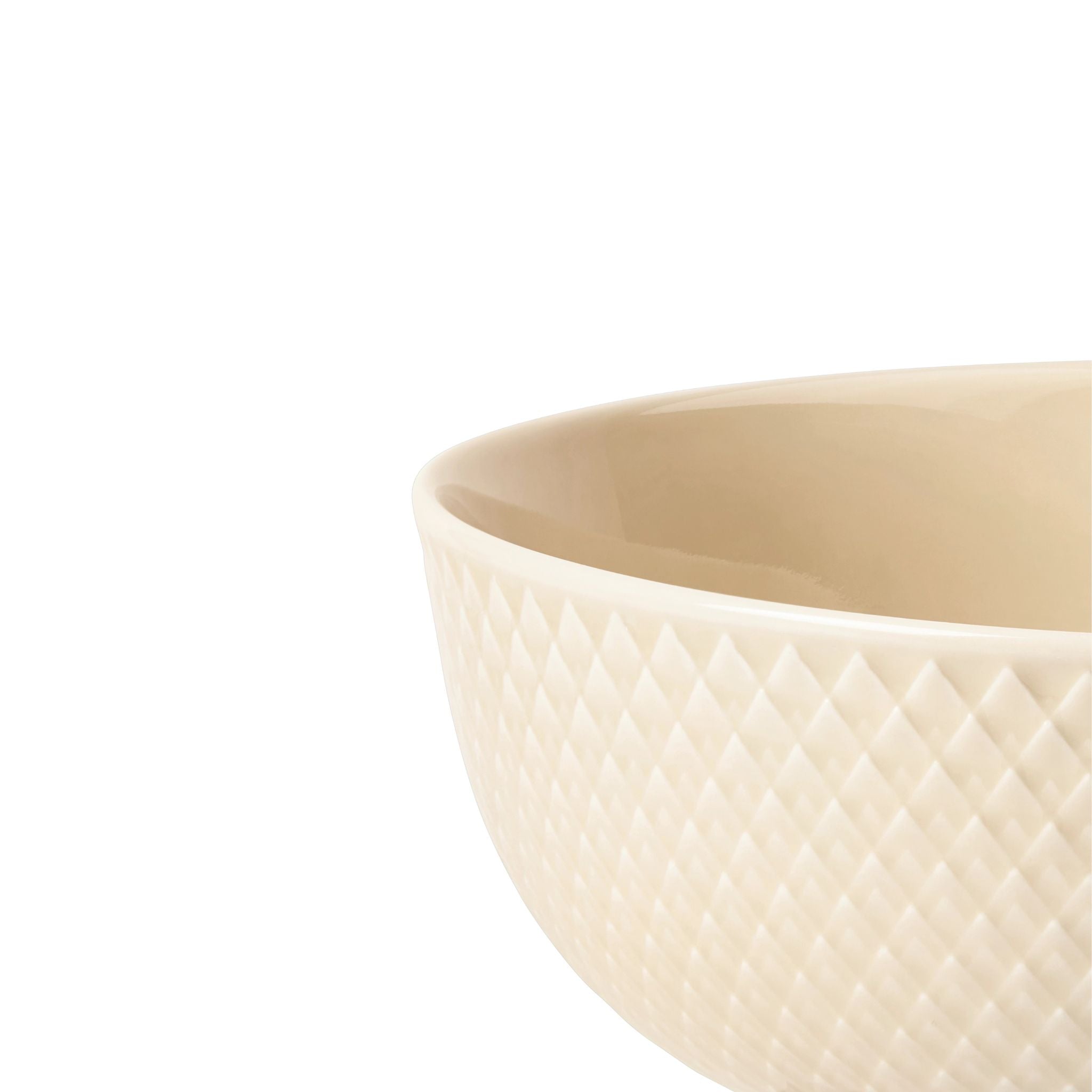 Beige ceramic porcelain bowl with textured surface on a white background