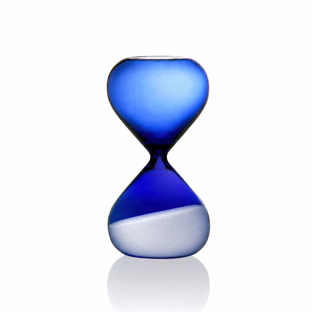 A translucent blue glass hourglass with a white sand fill in the lower chamber, set against a clean white background with a soft reflection below.
