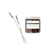 Terralite candle jar labeled 'Wild Lavender' with lavender sticks on a white background
