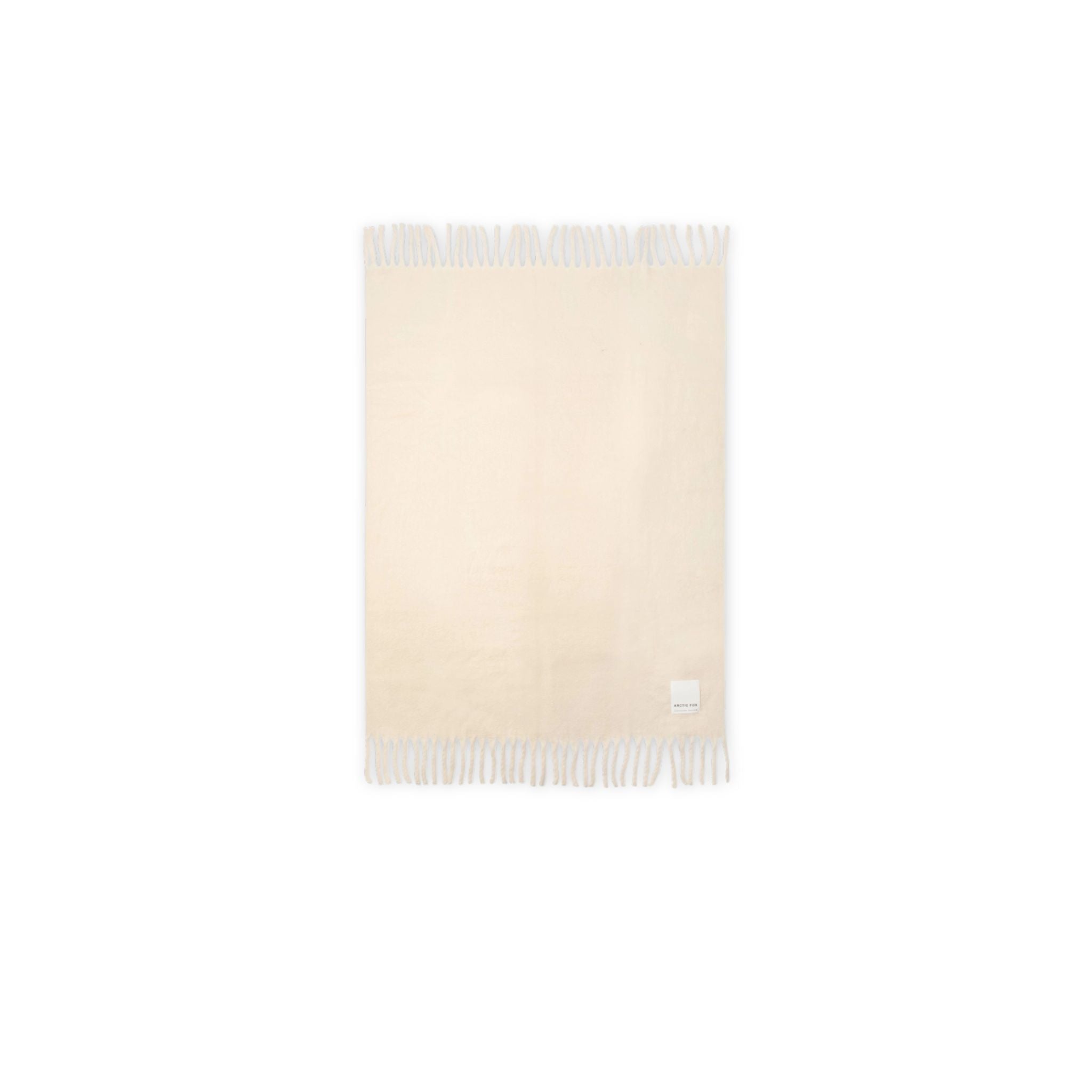 Beige throw with white fringe and white brand label Arctic Fox on a white background