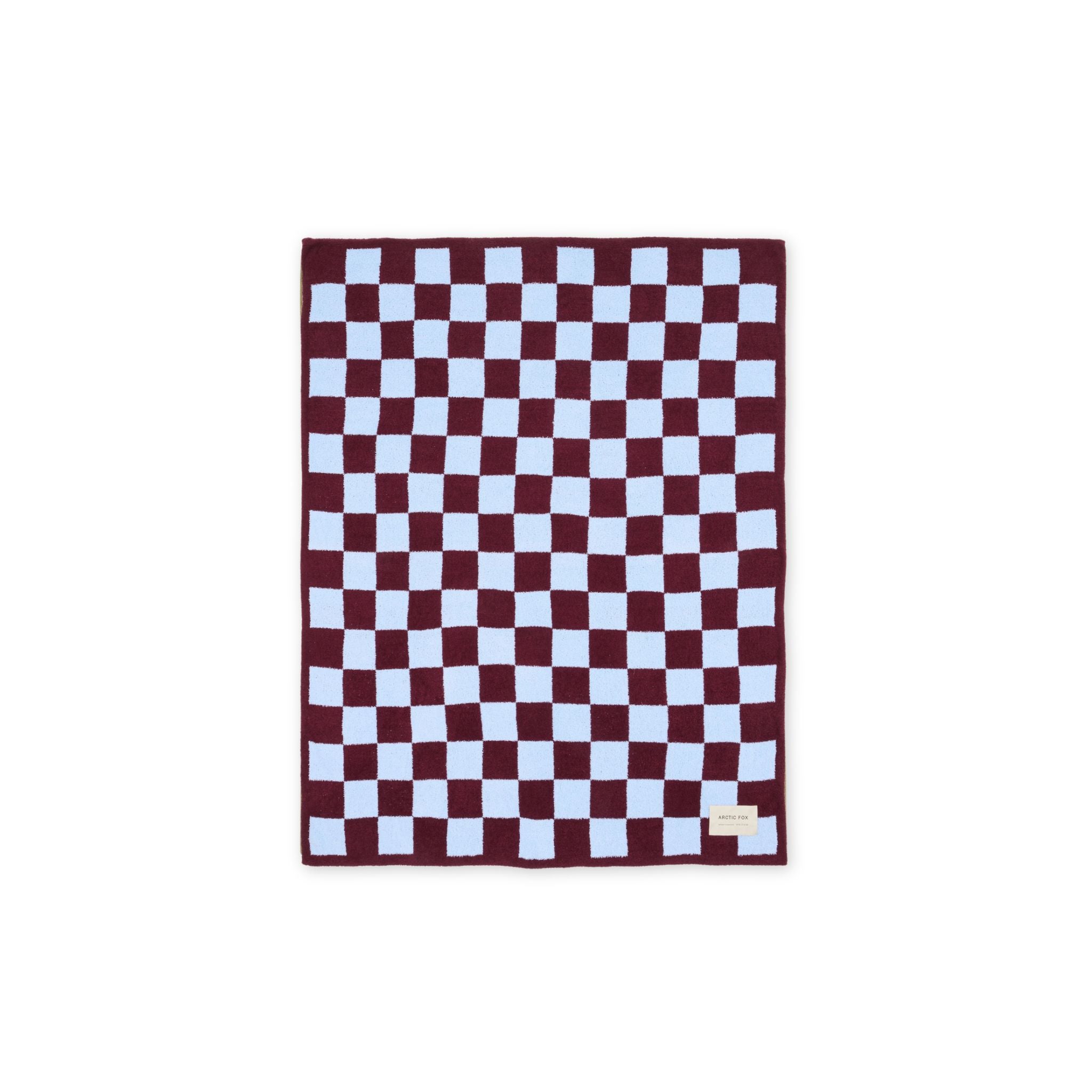 Checkered blanket with burgundy and blue pattern on a white background