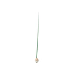 Minimalist green KUSA object with flexible stem and wooden base, designed in Japan by switch