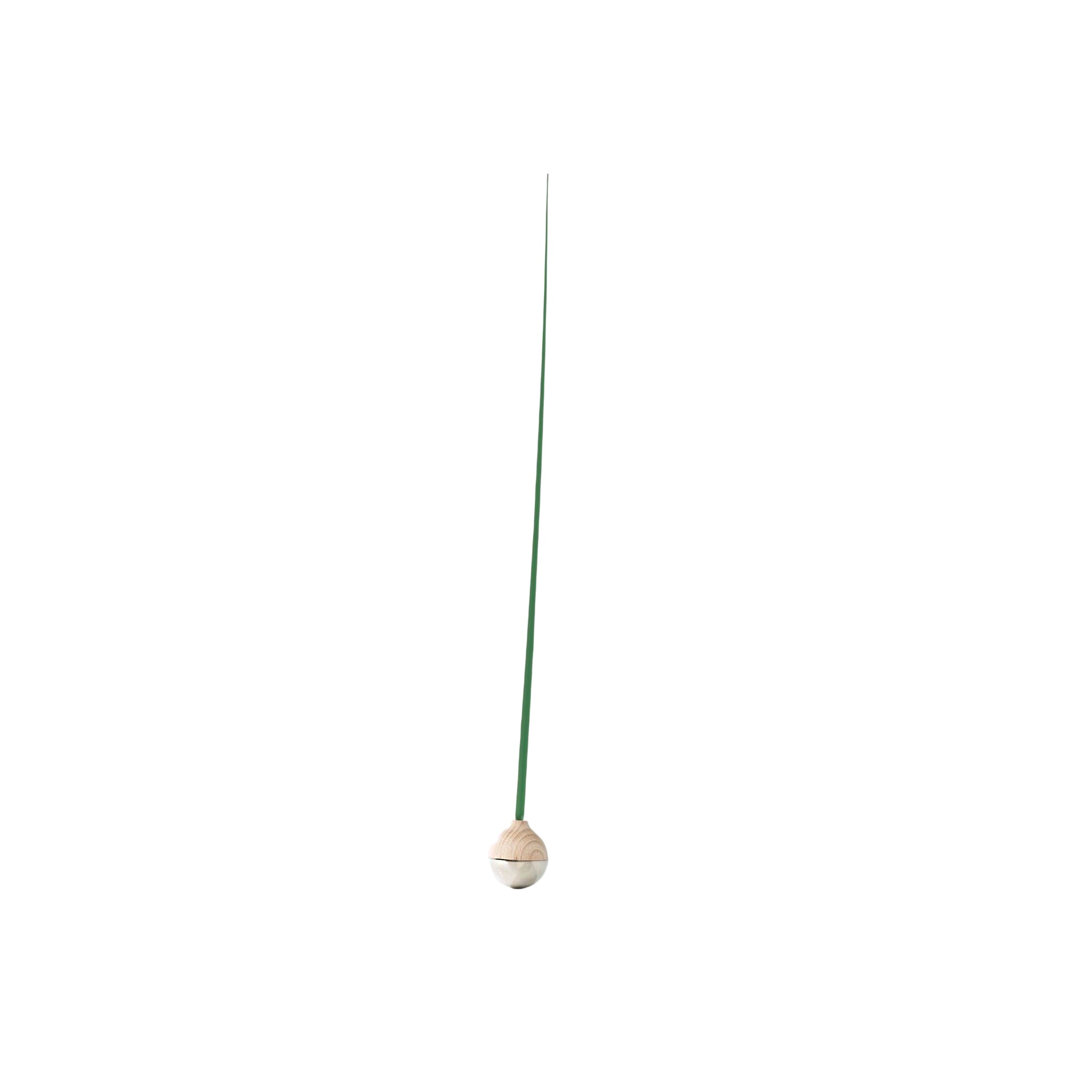 Minimalist green KUSA object with flexible stem and wooden base, designed in Japan by switch