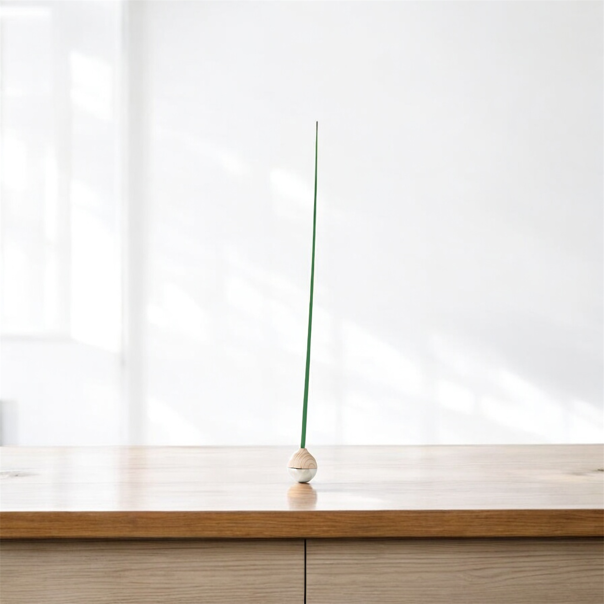 KUSA object on a wooden surface with a white background