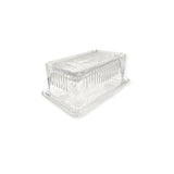 Clear glass beurre dish on a white background