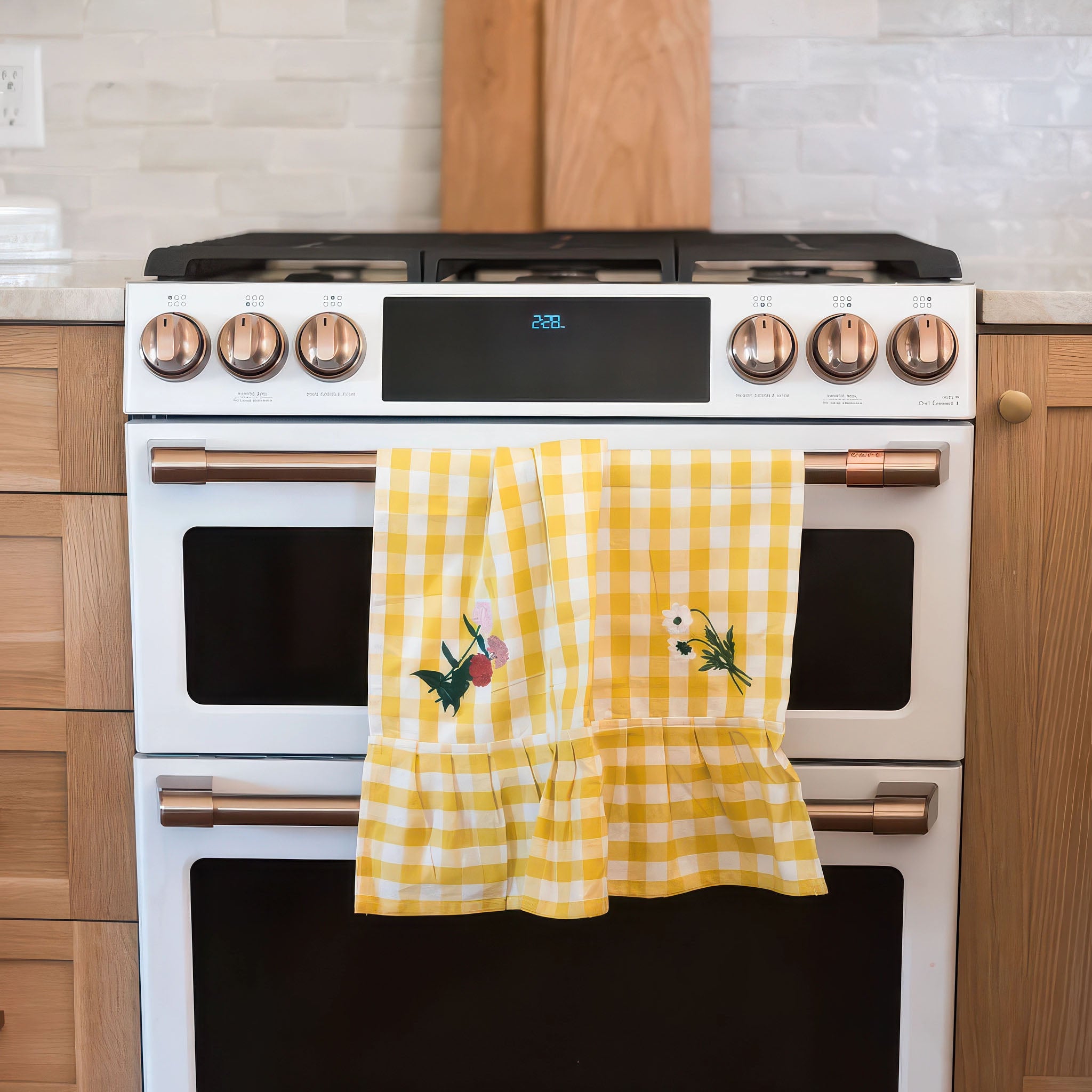 Image of Yellow Ruffled Gingham Dish Towel hanging from a stove