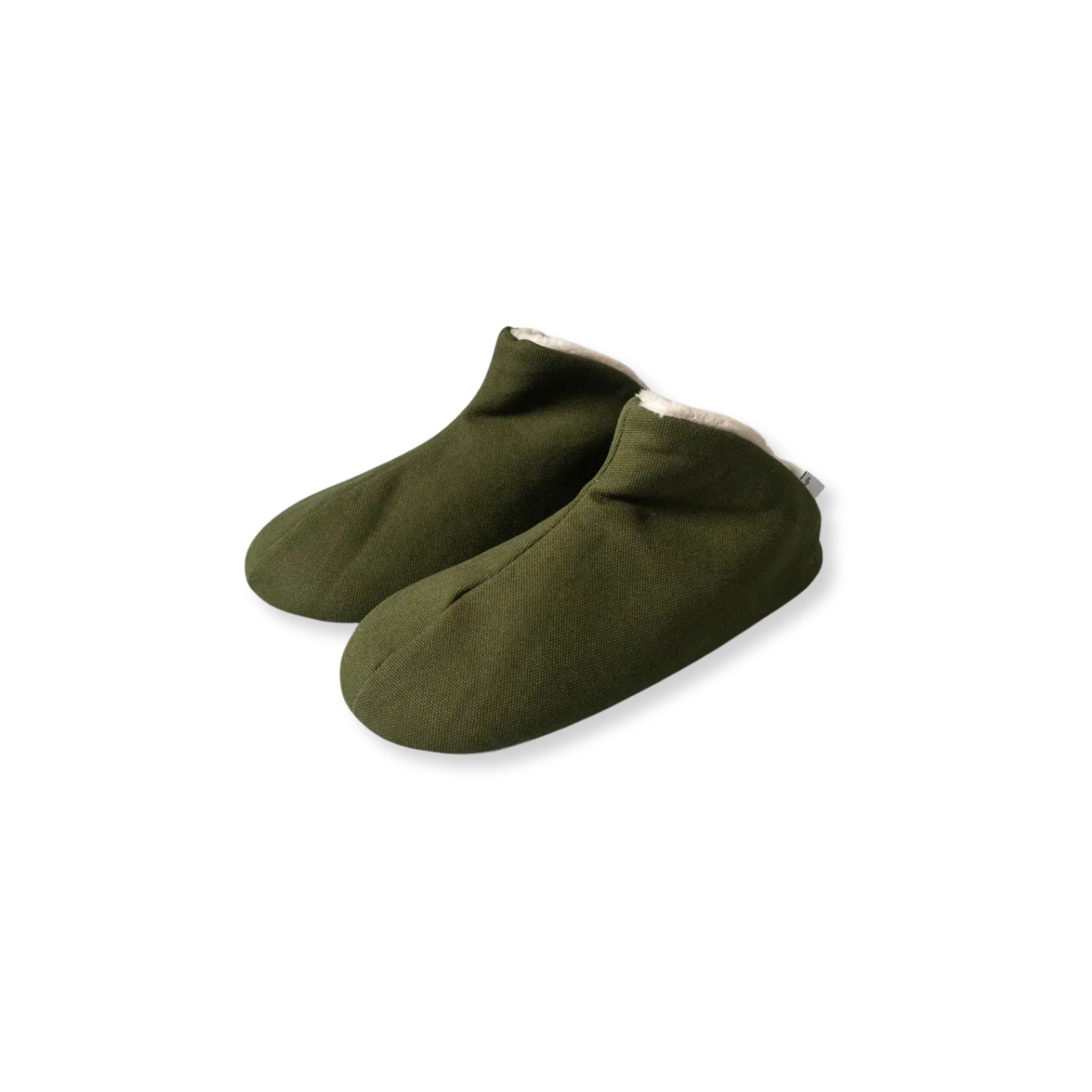 Pair of green slippers on a white background