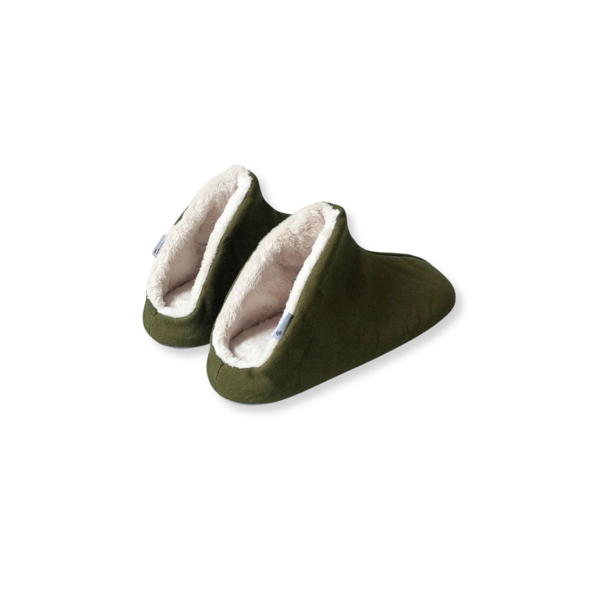 Pair of green slippers with white furry lining on a white background