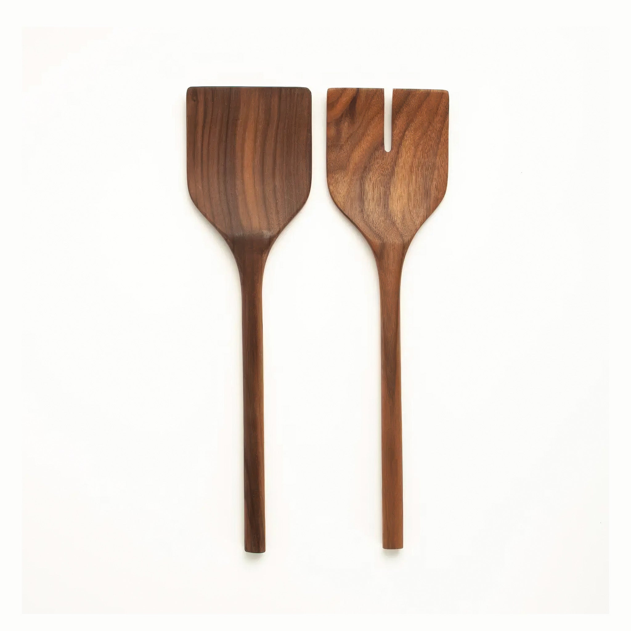 A pair of wooden walnut salad servers on a white background.