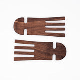 A pair of wood salad hands on a white background