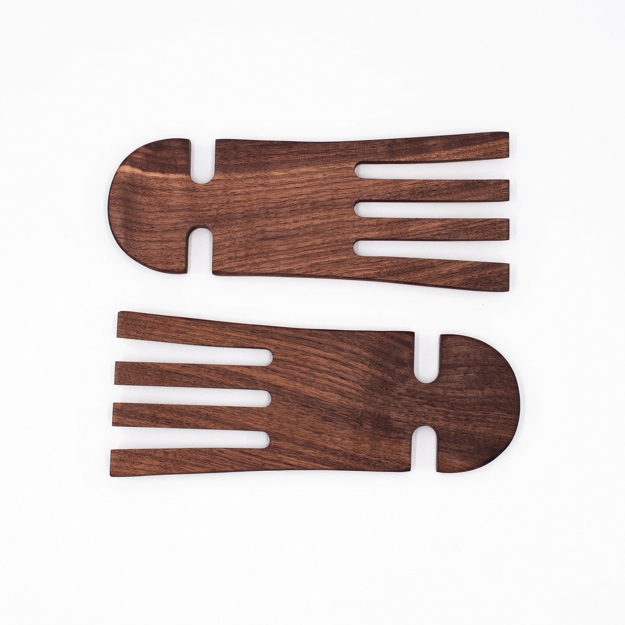 A pair of wood salad hands on a white background