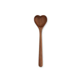 Wooden heart shaped spoon on a white background