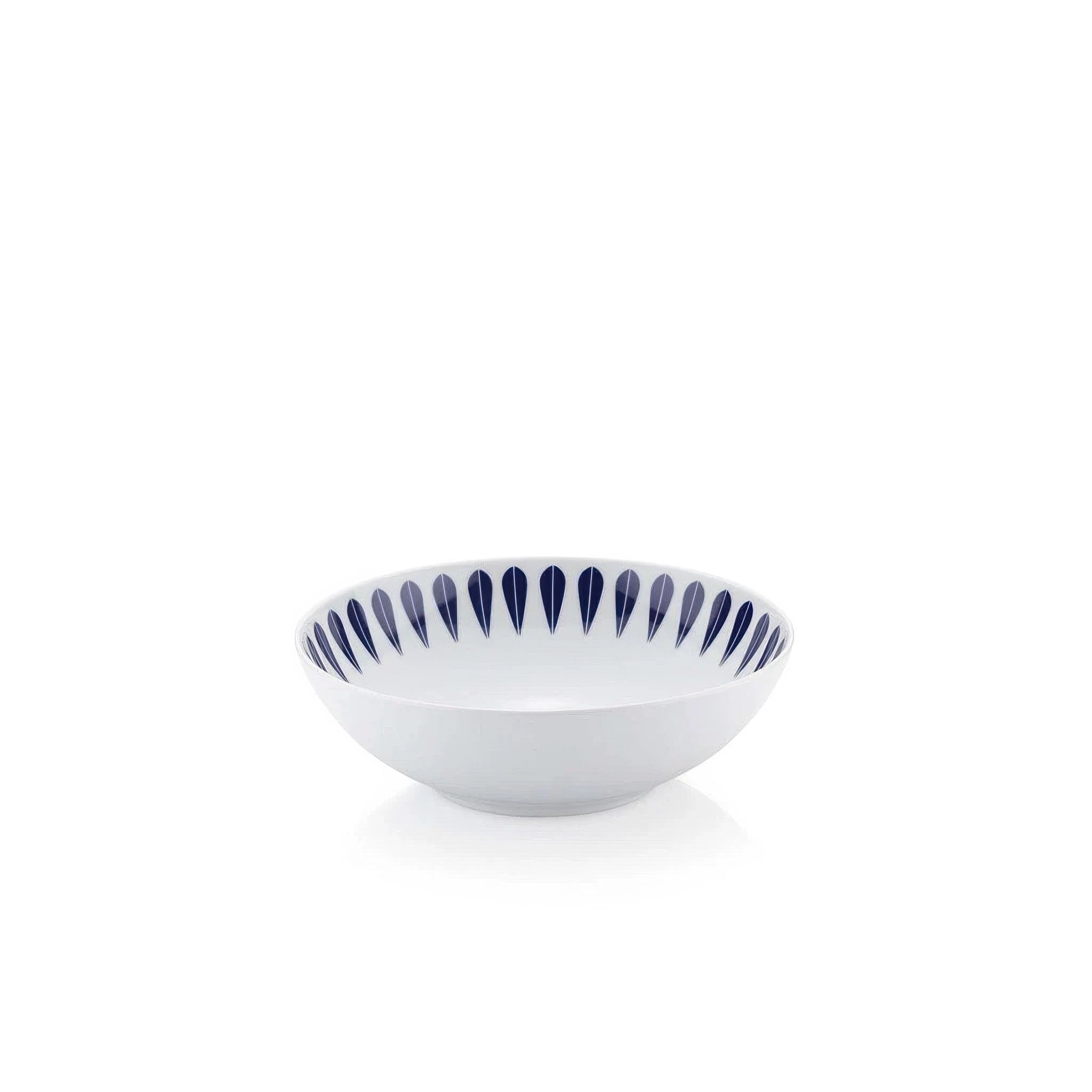 White ceramic bowl with blue decorative lotus rim on a white background