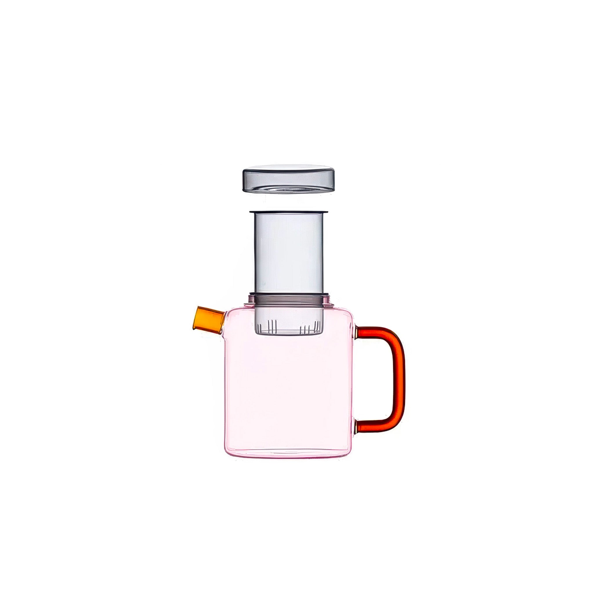 Pink glass teapot with amber spout, red handle, and clear gray lid and infuser, shown against a white background.