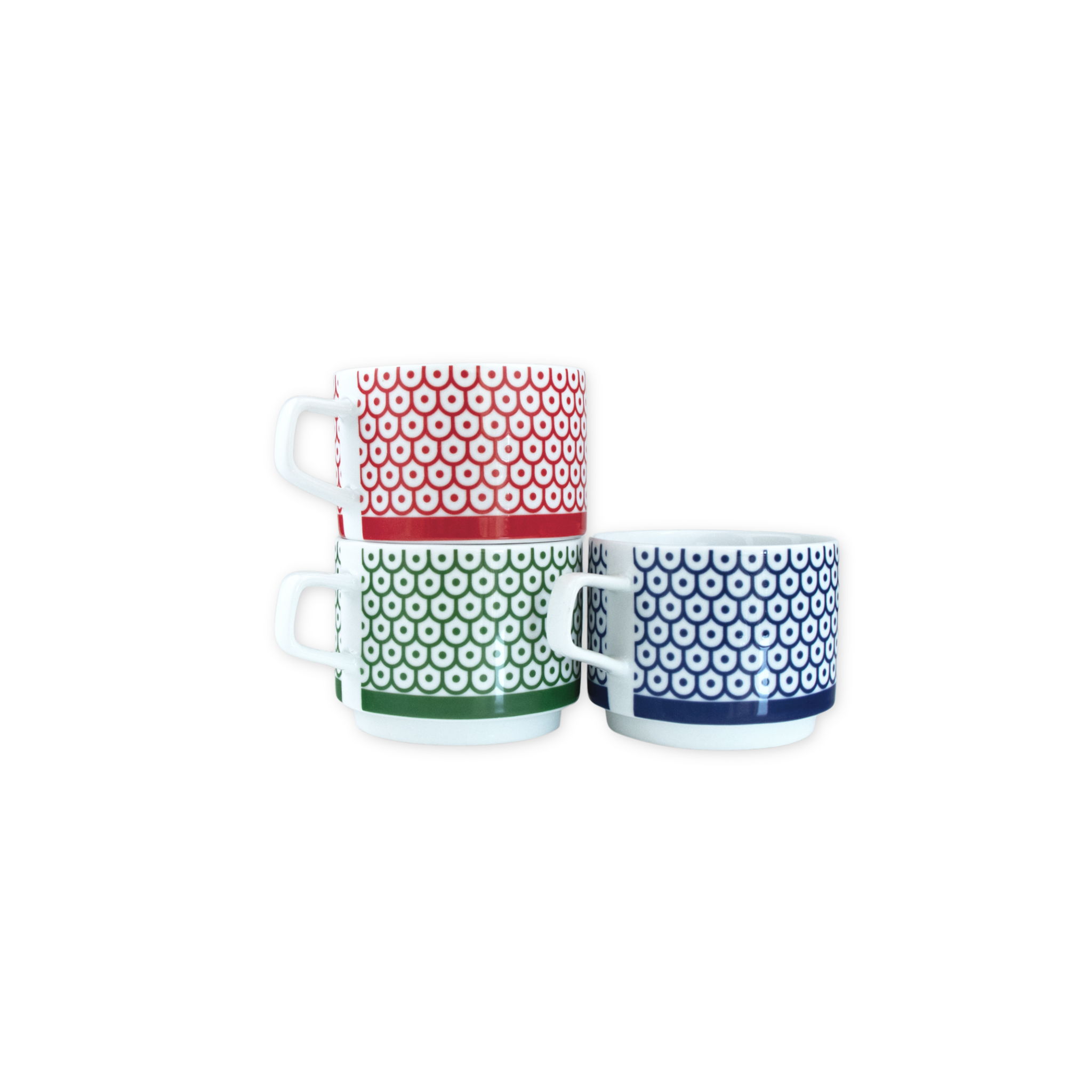 Porcelain stacking mugs featuring Marguerita Mergentime’s Shield and Dot pattern in red, green, and blue.
