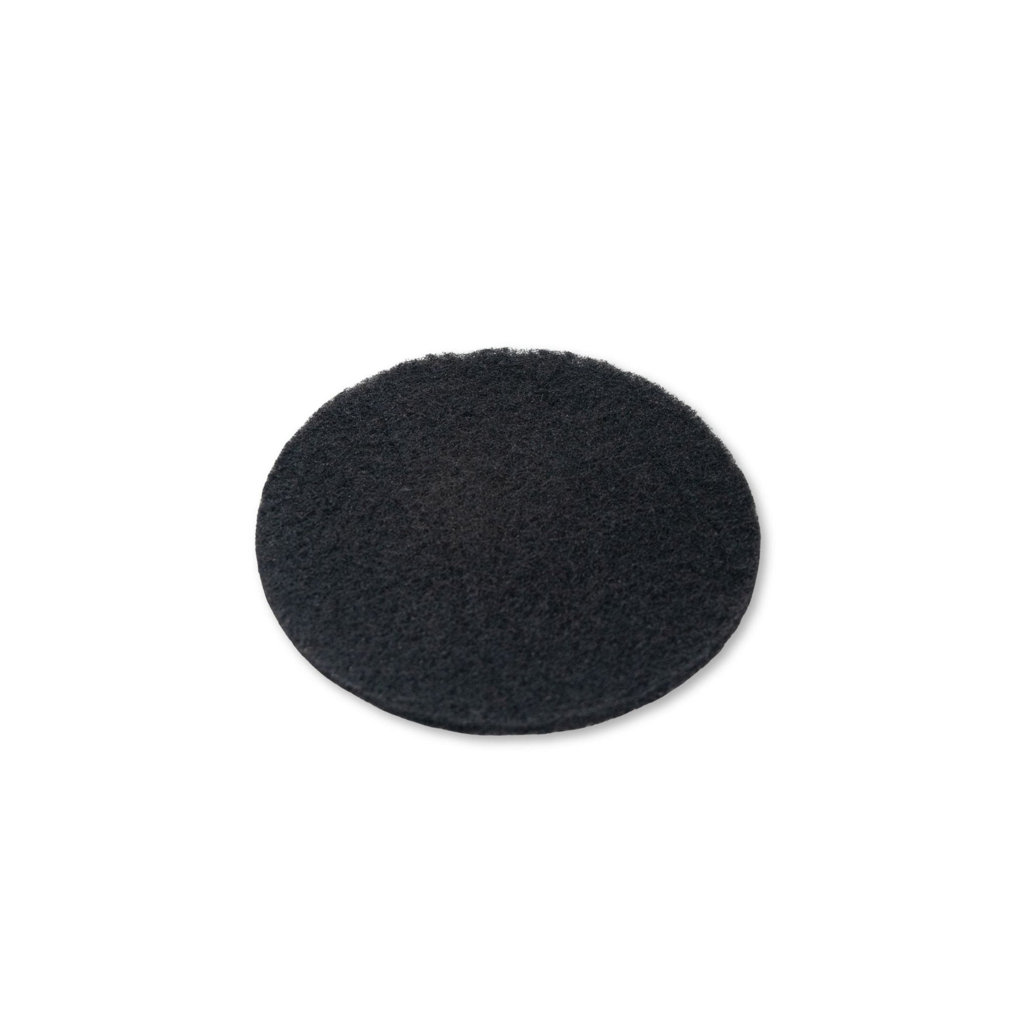 Black round charcoal filters on a white background