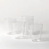 Set of clear glass tumblers on a white background