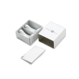 Gift-boxed porcelain lovebird chopstick rests designed by Masahiro Mori – set of two shown in open packaging with minimalist white box and booklet.
