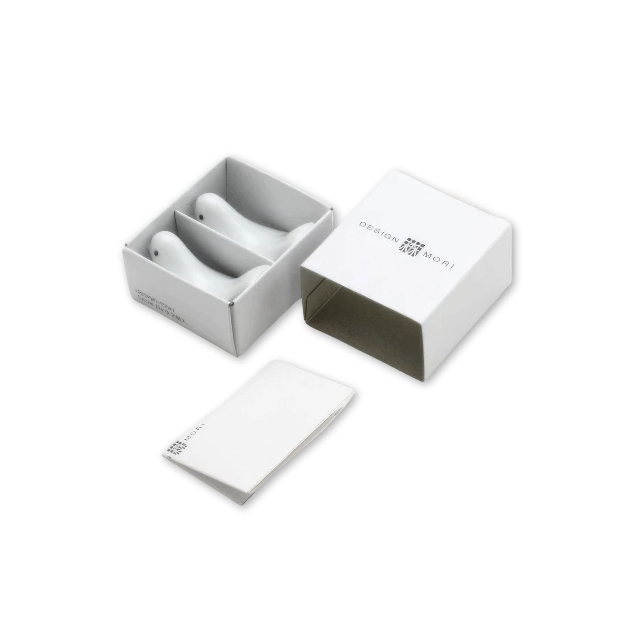 Gift-boxed porcelain lovebird chopstick rests designed by Masahiro Mori – set of two shown in open packaging with minimalist white box and booklet.