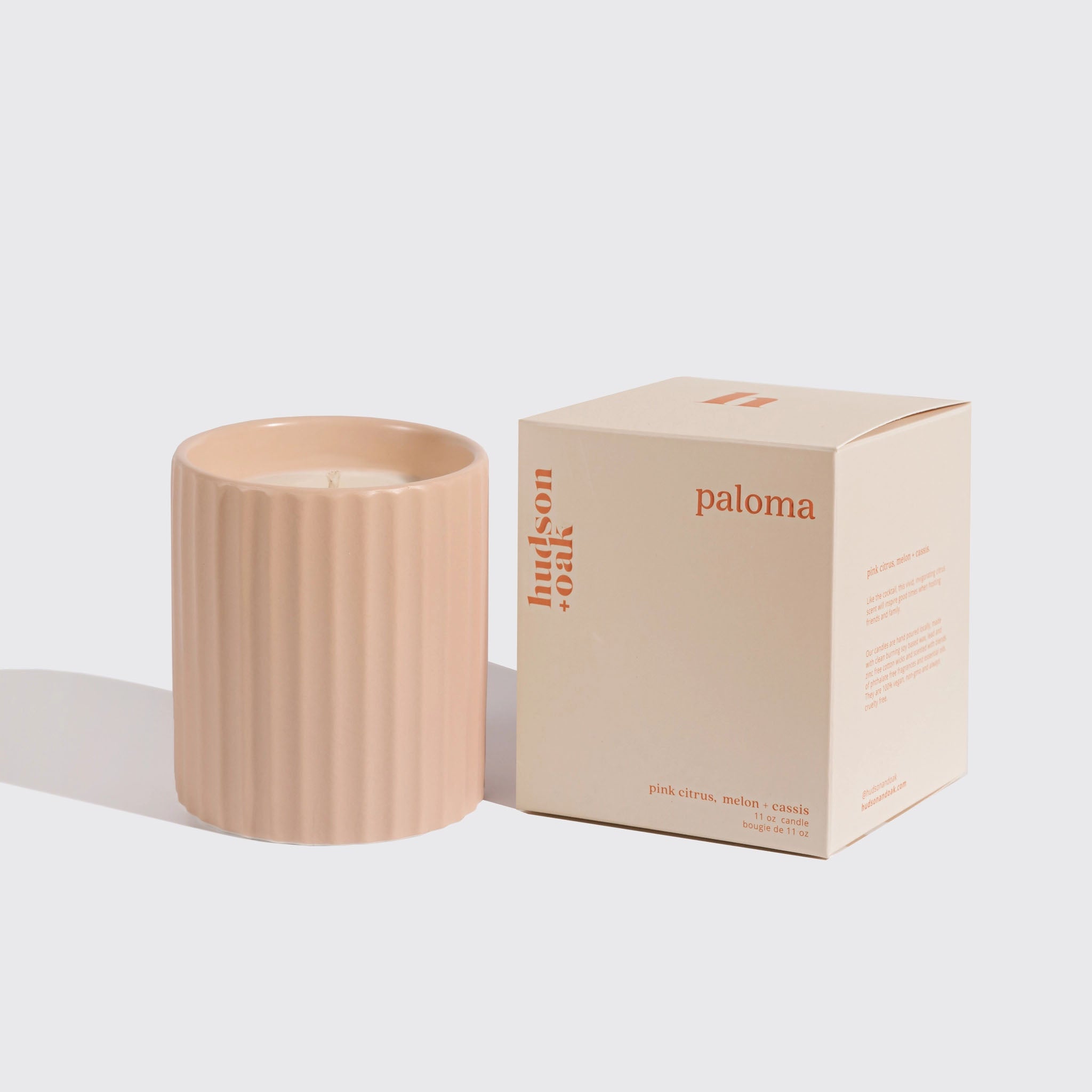 image of hudson oak scented candle paloma next to box