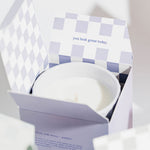 close up image of hudson oak scented candle wild flower in open box