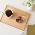 image of mini glass plate cat face shape on tray holding chocolate pieces 