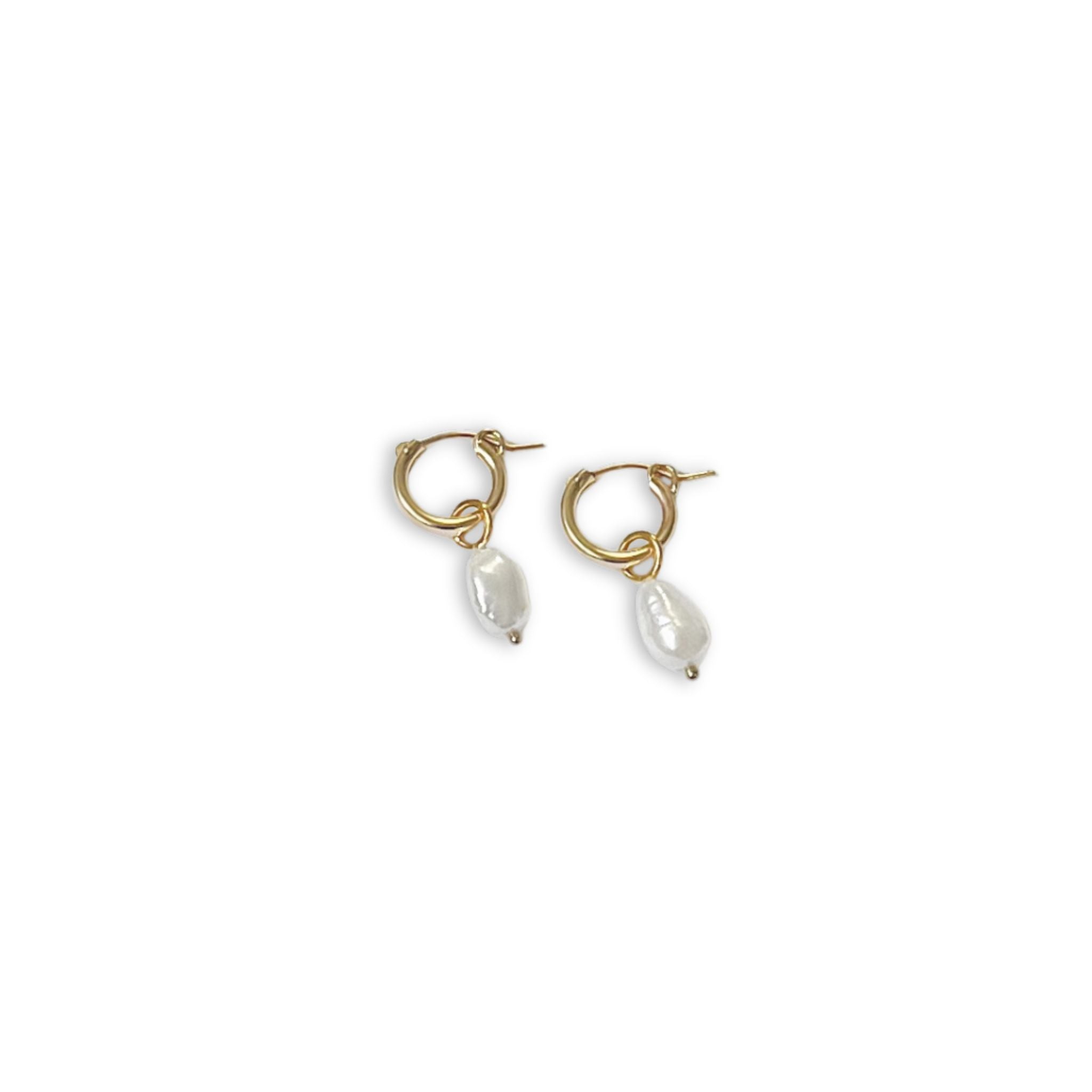View of Anna Hoops + Pearl Drop Charms earrings by Kara Yoo