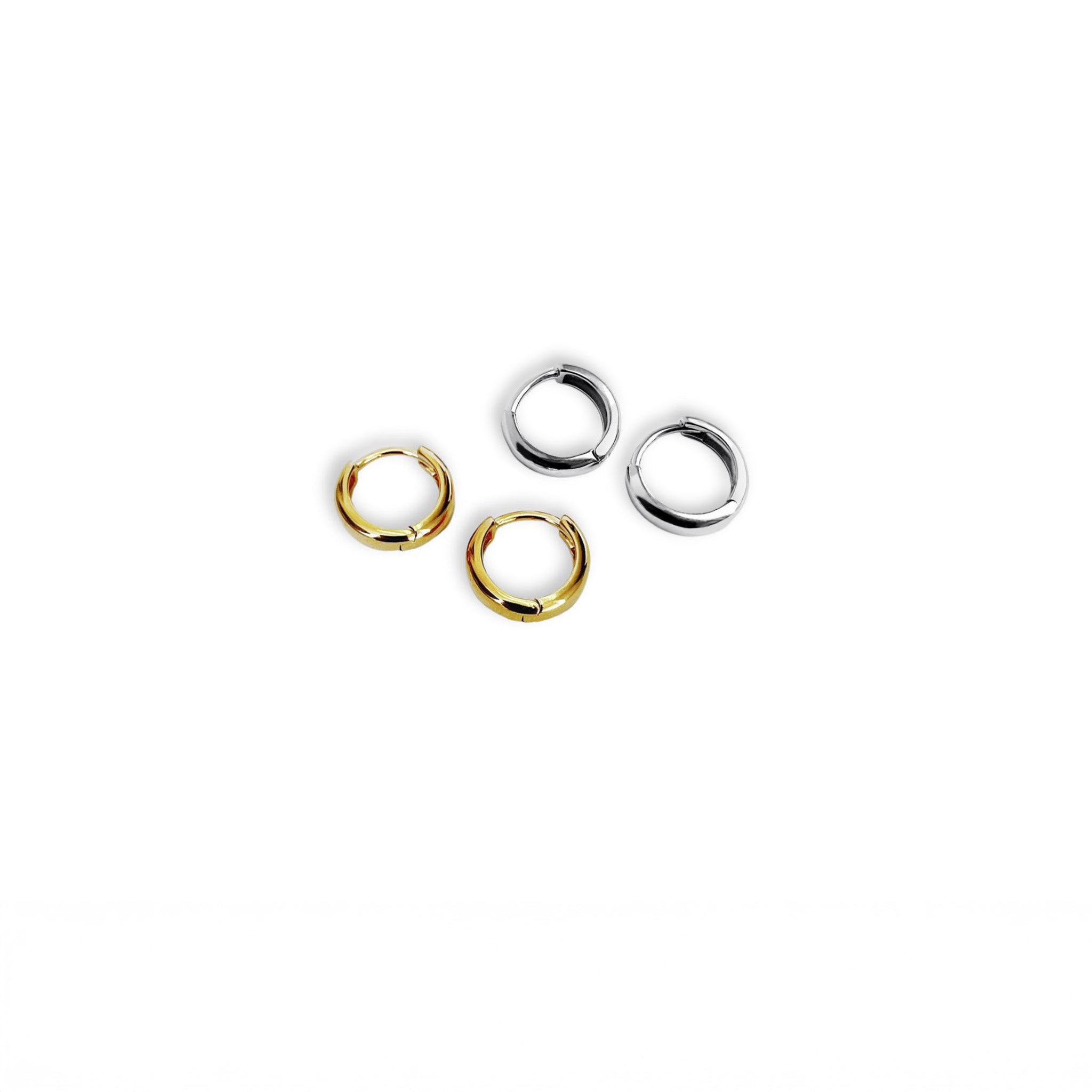 Full view of Kara Yoo's Norma Huggie hoops in silver and gold vermeil