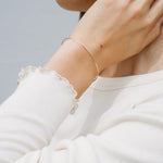 A model wearing the sterling silver thin cuff bracelet