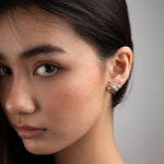 A model wearing Maisie sterling silver earrings