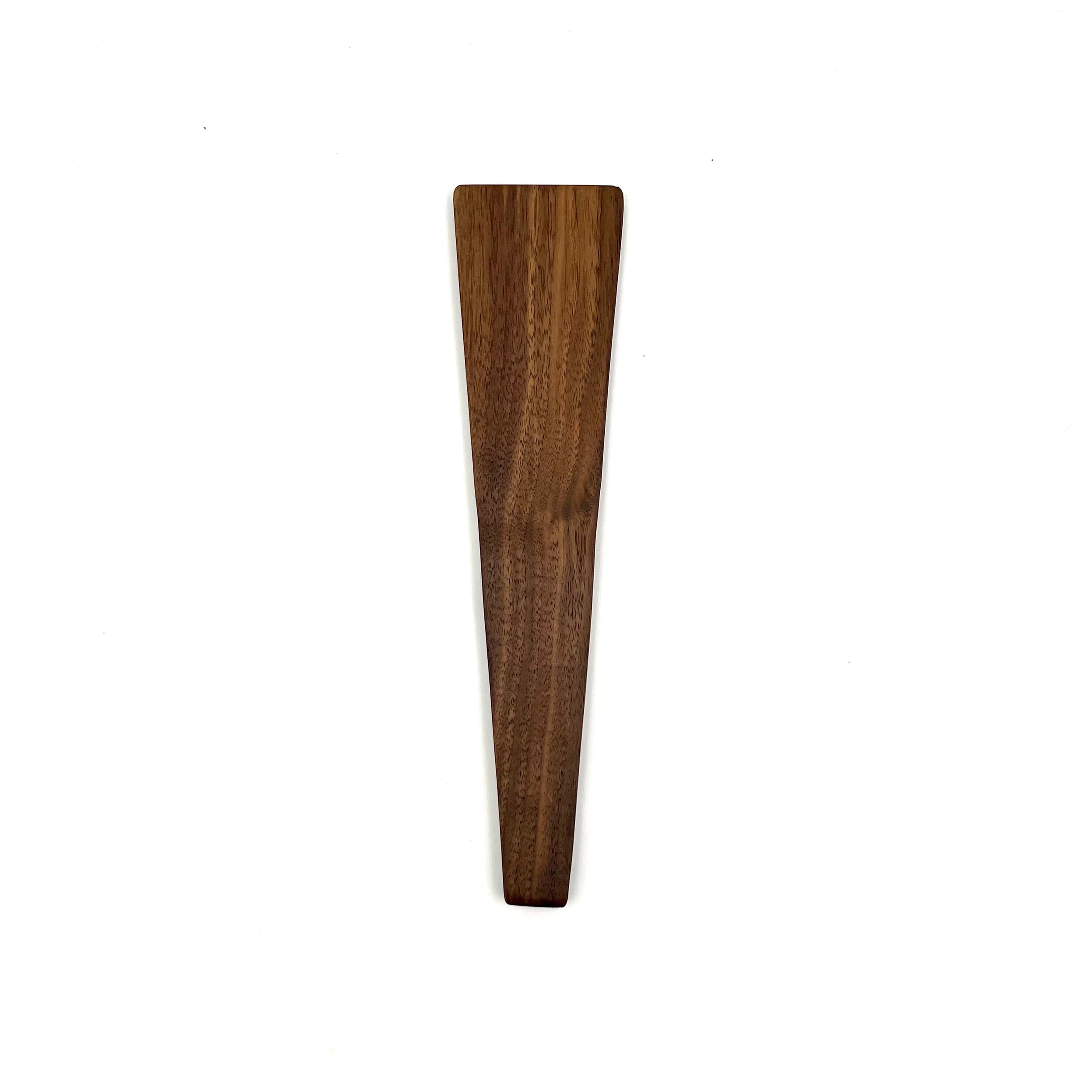 Walnut wooden scraper spatula on a white background