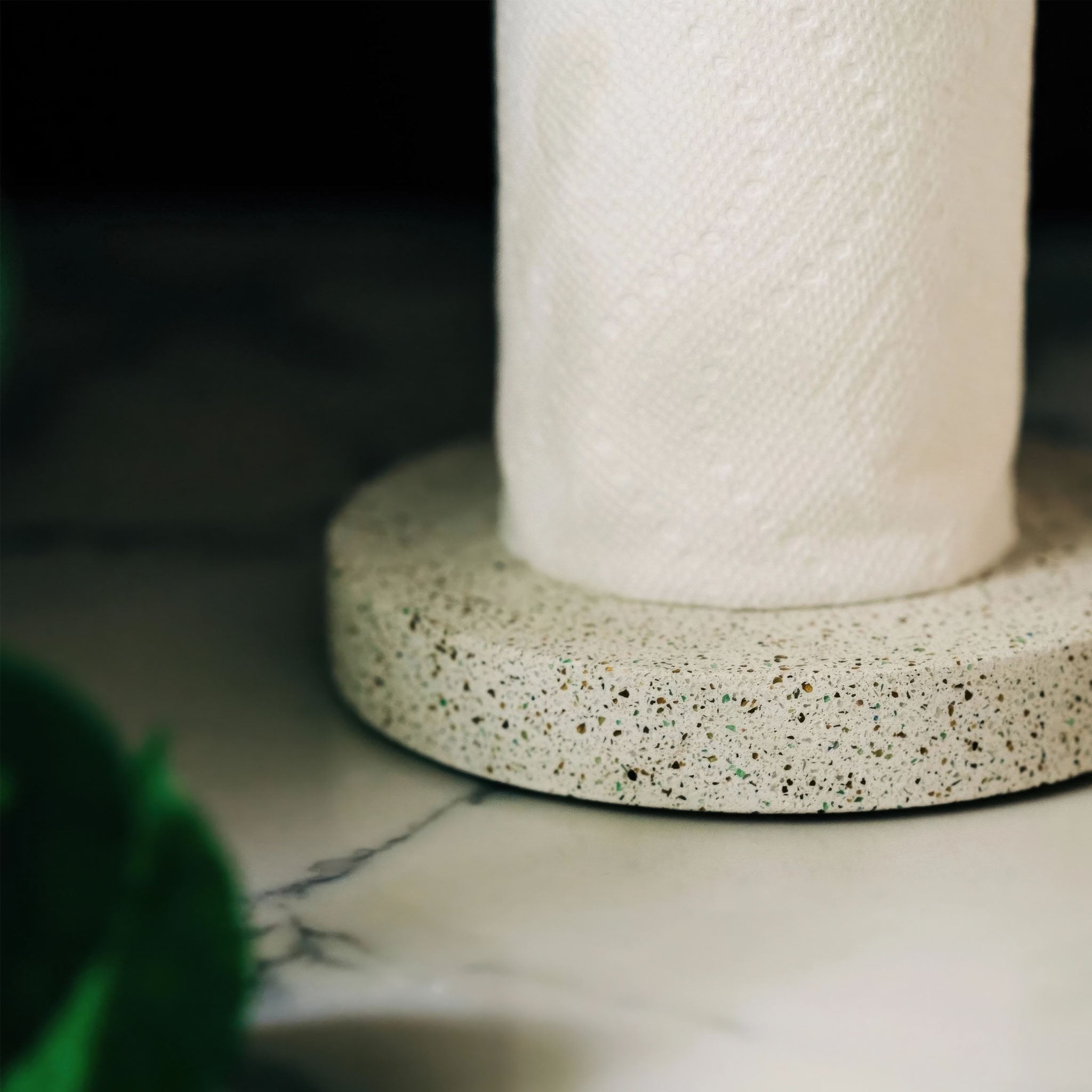 Close-up of the concrete base of the paper towel holder 