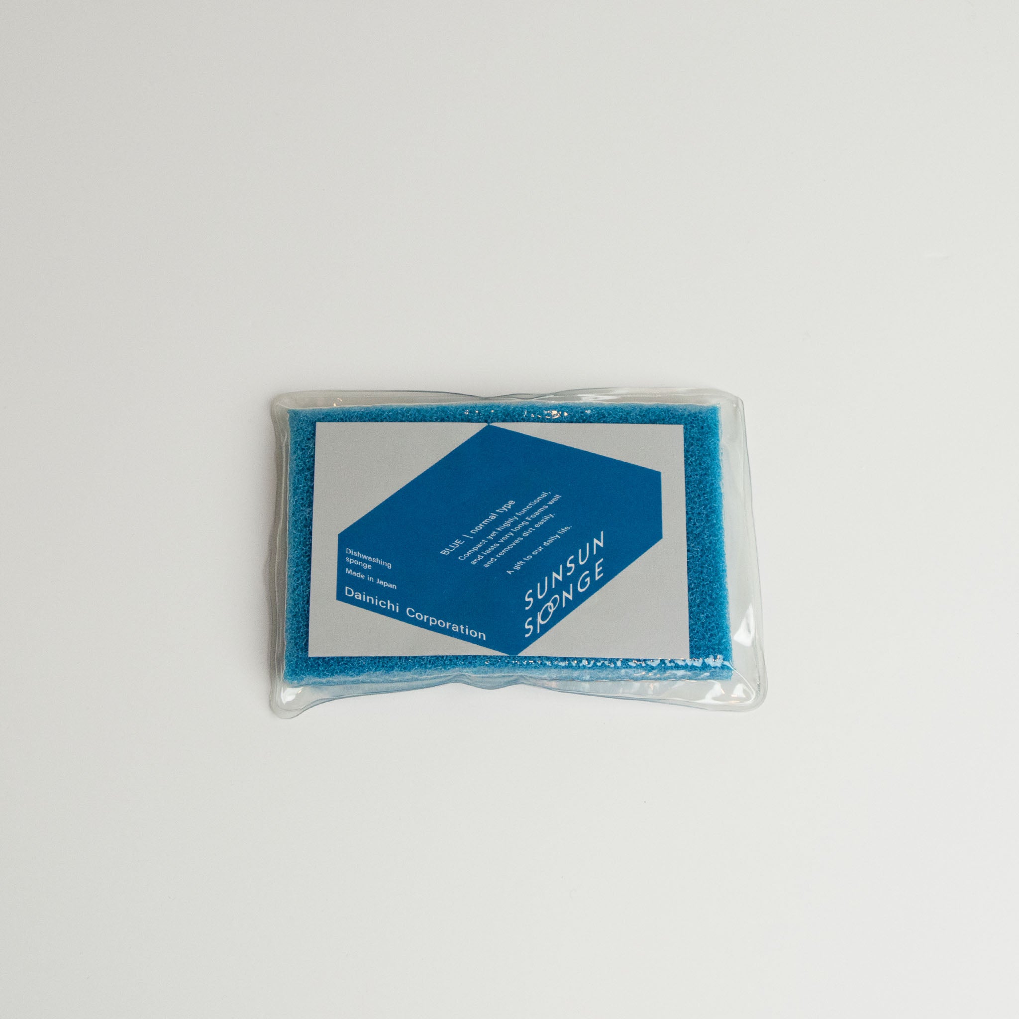 Blue Sunsun sponge in packaging with on a white background