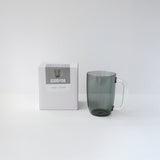 Gray mug with a matching box labeled 'GOOD FOR' on a white background