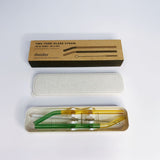 Two-tone glass straw set with packaging on a white background