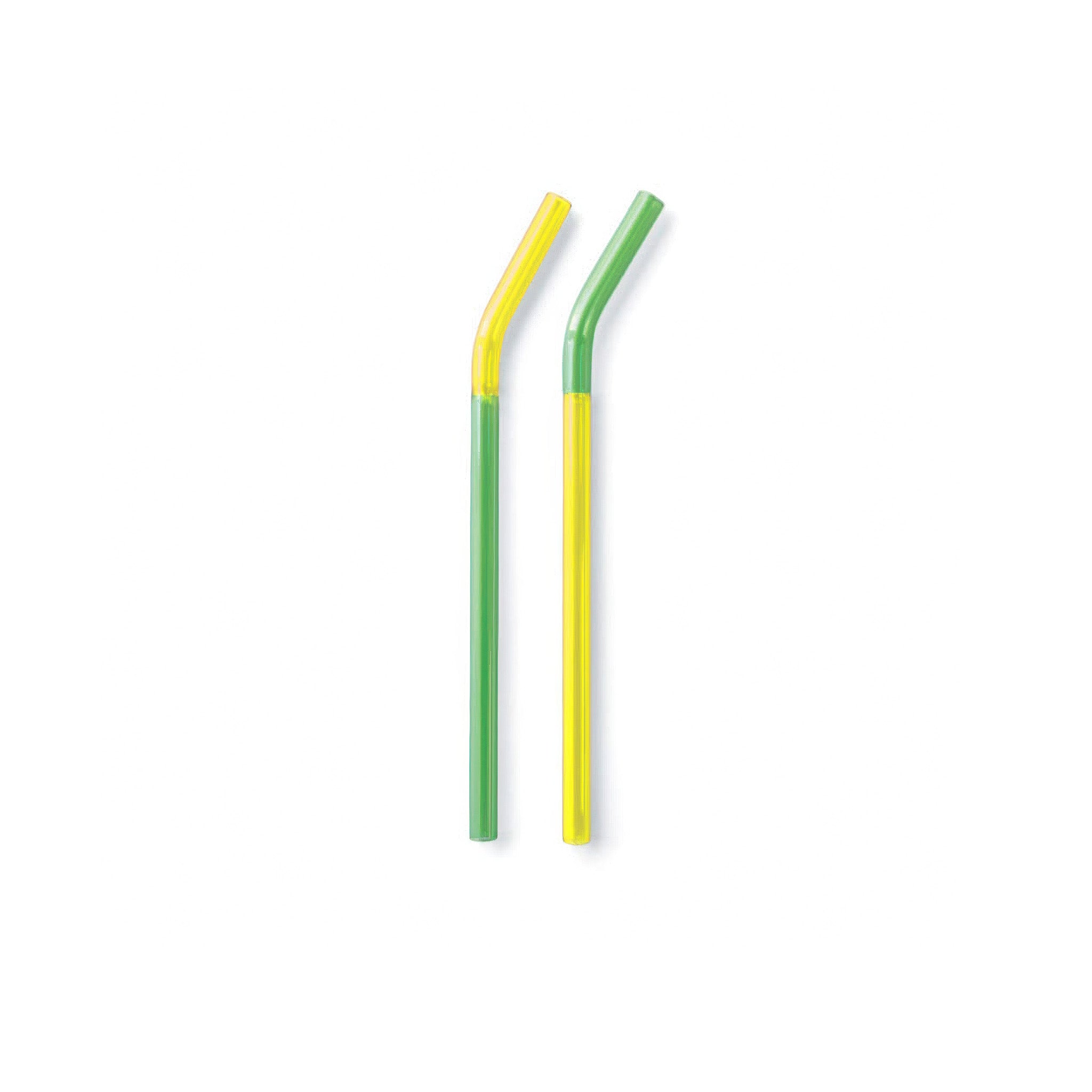 Two toned yellow x green glass straws on a white background