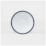 White enamelware bowl with a dark navy trim on a white background