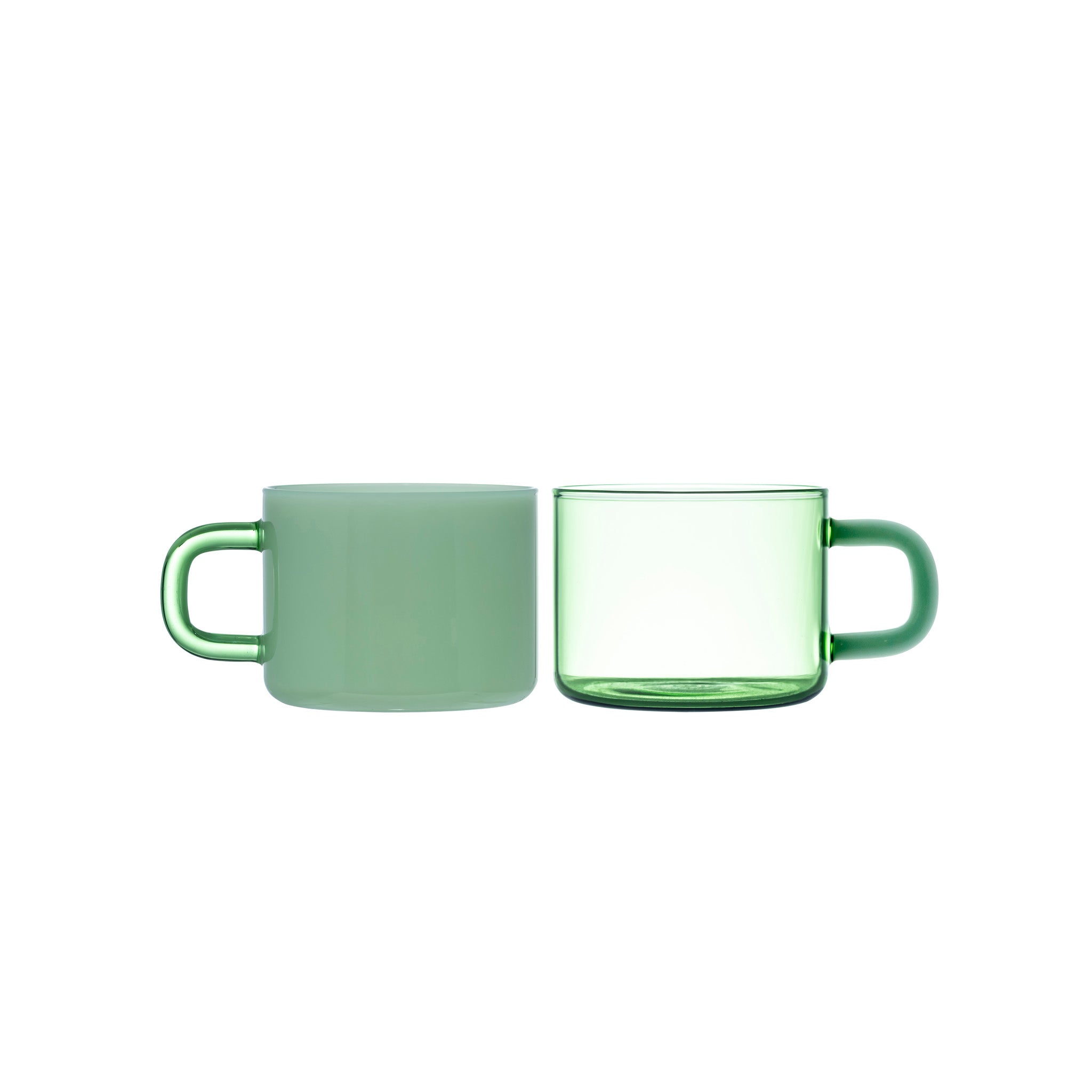 Two green mugs, one ceramic and one glass, on a white background