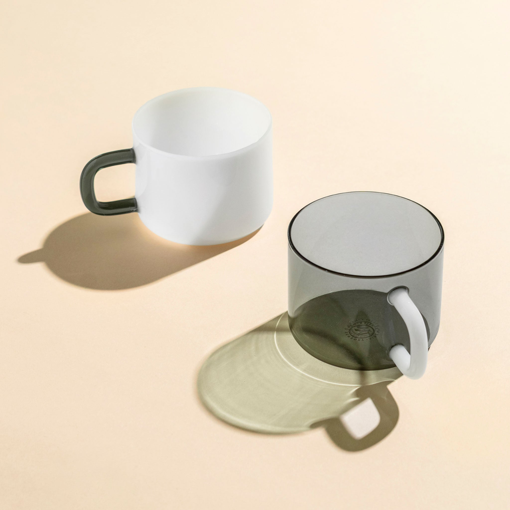 The Panda Chá Mug Set on a beige background