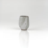 Tall slender handmade ceramic sake cup in soft grey glaze with smooth matte finish by The Lazy Potters.
