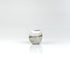 Compact handmade ceramic sake cup with soft white glaze and warm exposed clay horizon line, by The Lazy Potters.
